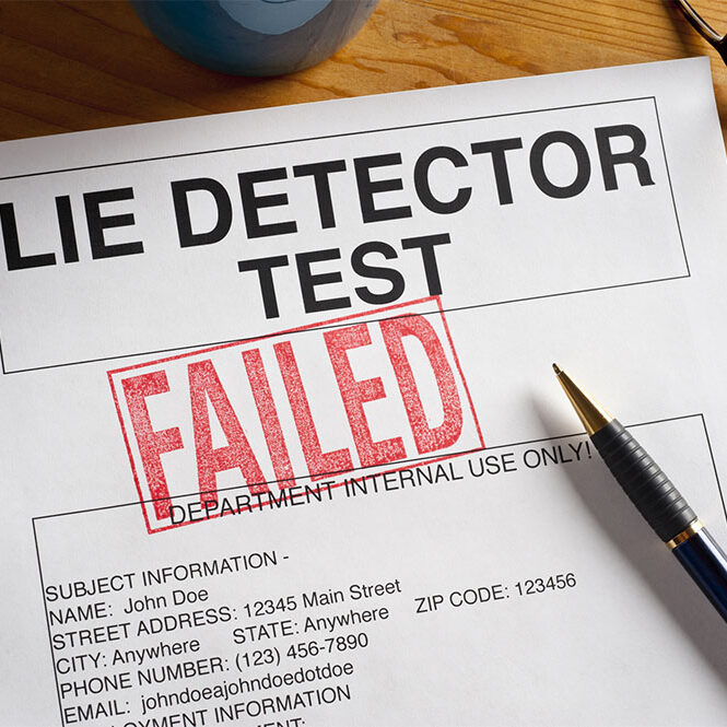 "Lie Detector Test for on a desktop stamped with FAILED.  Artwork created by the photographer,"